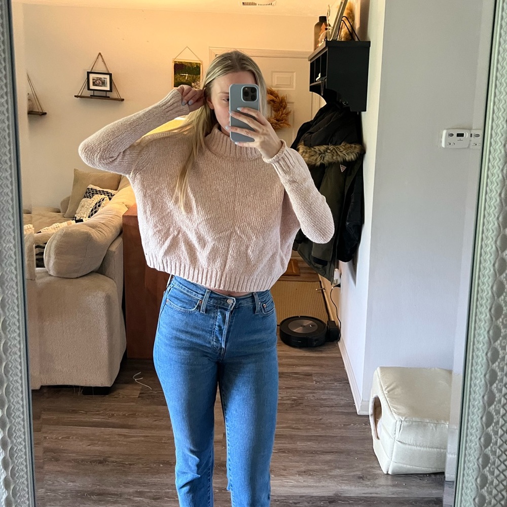 Cropped pink turtleneck sweater
